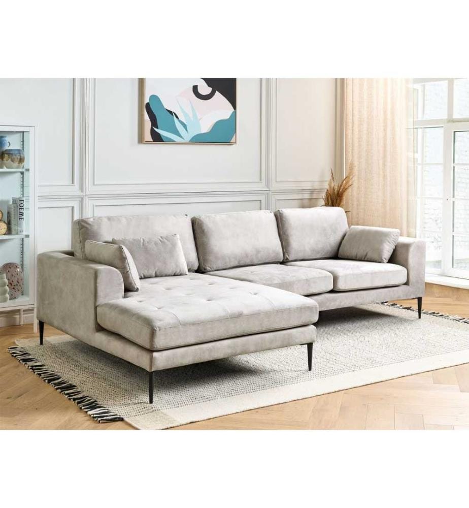 Canapé d'angle droit en L en velours blanc crème avec assise et dossier matelassés.