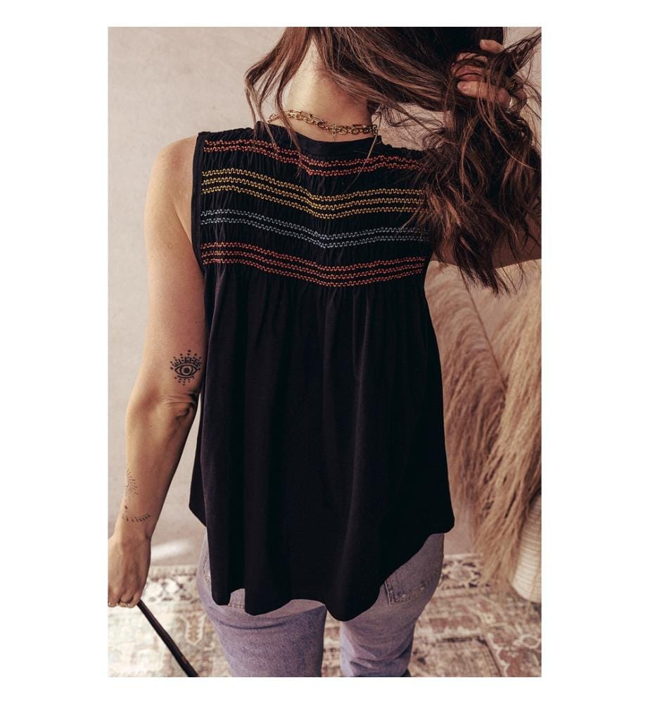 Black tank top with notched V-neck and colorful gathered yoke