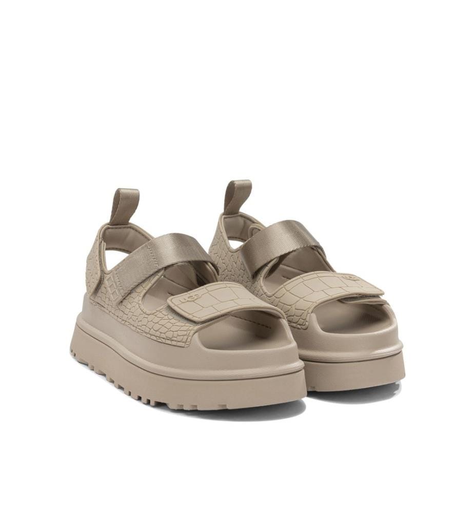 „Goldenglow Embossed“ Flache Sandalen – Beige