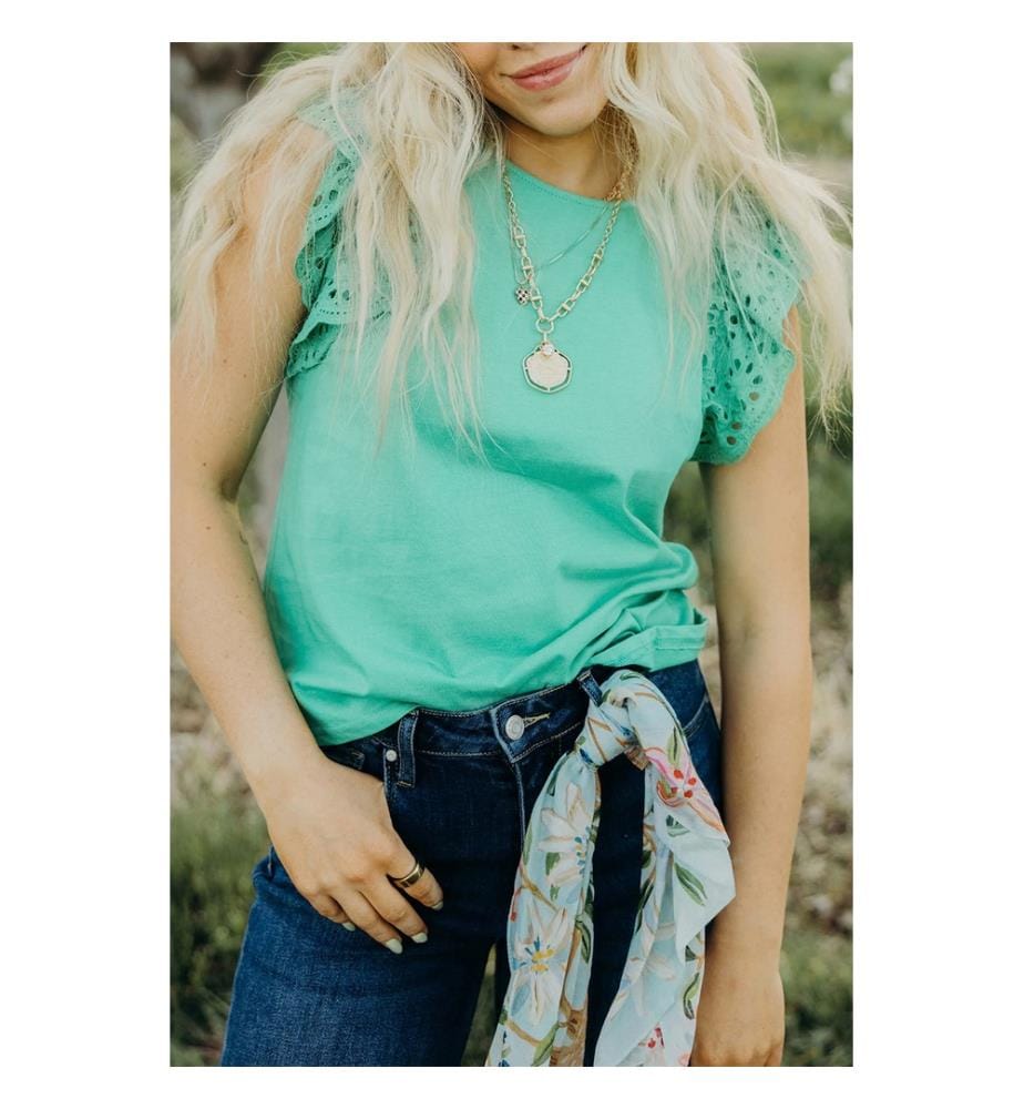 Short-sleeved ruffled top in mint green openwork lace