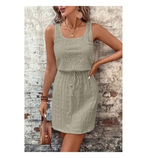 Textured eyelet mini dress with square collar and drawstring, adorned with a four-leaf clover