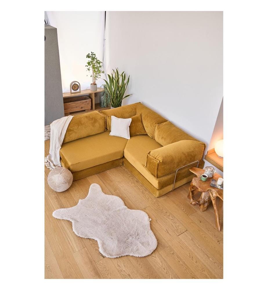 Divano letto angolare, tessuto felpato a coste 100%, color senape.